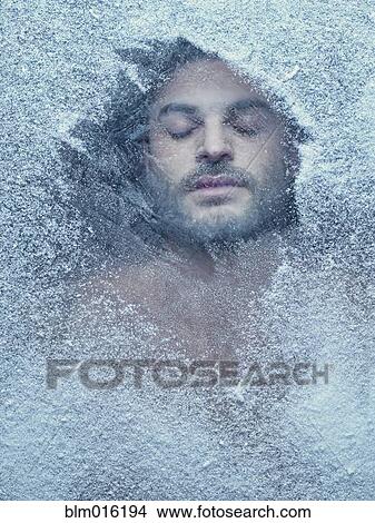 Hispanic man behind snow covered window View Large Photo Image Picture - Hispanic man behind snow covered window. Fotosearch