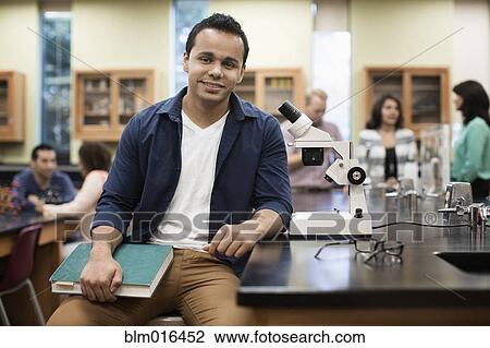 Hispanic student at desk in lab classroom View Large Photo Image Stock Image - Hispanic student at desk in lab classroom. Fotosearch