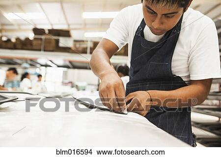 Man working in manufacturing plant View Large Photo Image Picture - Man working in manufacturing plant. Fotosearch