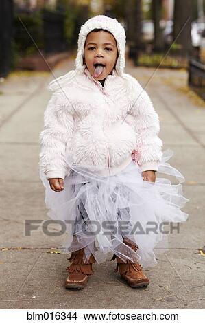 Picture - Mixed race girl wearing fairy costume. Fotosearch