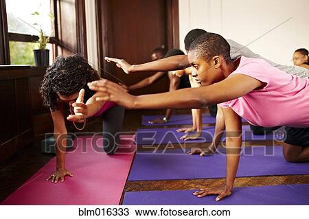 People practicing yoga in class View Large Photo Image Stock Image - People practicing yoga in class. Fotosearch