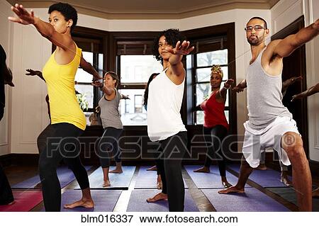 People practicing yoga in class View Large Photo Image Stock Photo - People practicing yoga in class. Fotosearch