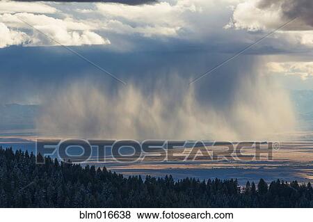 Storm clouds over rural valley View Large Photo Image Stock Photo - Storm clouds over rural valley. Fotosearch
