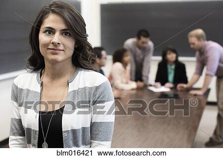 Student smiling in classroom View Large Photo Image Stock Image - Student smiling in classroom. Fotosearch