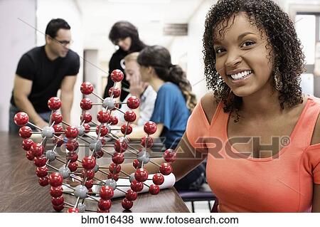Stock Photo - Student with molecular model in classroom. Fotosearch