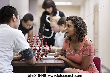 Stock Photograph - Students examining molecular model. Fotosearch