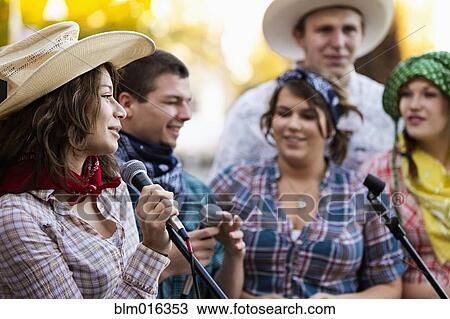 Stock Image - Students singing together. Fotosearch