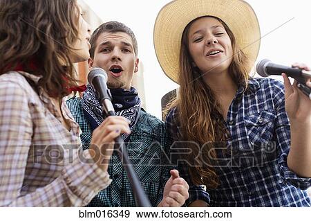 Students singing together View Large Photo Image Stock Photo - Students singing together. Fotosearch