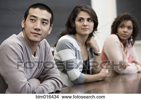 Students sitting in classroom View Large Photo Image Picture - Students sitting in classroom. Fotosearch