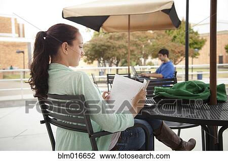 Students studying at tables on campus View Large Photo Image Stock Image - Students studying at tables on campus. Fotosearch