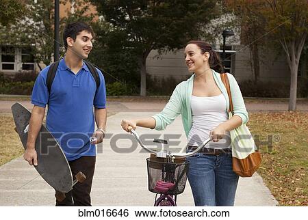 Stock Photograph - Students walking together on campus. Fotosearch