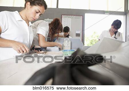 Stock Photography - Women working in manufacturing plant. Fotosearch