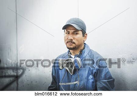 Worker standing in manufacturing plant View Large Photo Image Stock Image - Worker standing in manufacturing plant. Fotosearch
