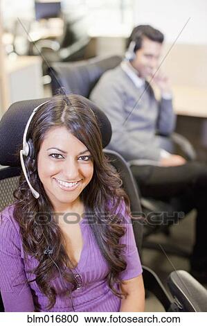 Asian businesswoman wearing headset View Large Photo Image Stock Image - Asian businesswoman wearing headset. Fotosearch