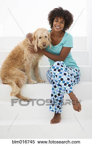 Black woman hugging dog View Large Photo Image Stock Photography - Black woman hugging dog. Fotosearch