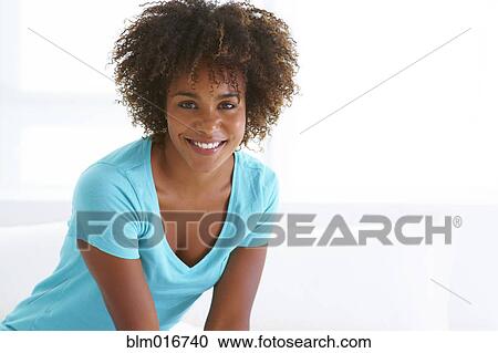 Stock Image - Black woman smiling. Fotosearch