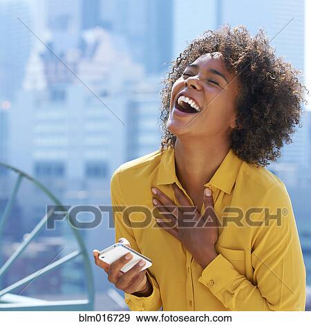 Black woman using cell phone View Large Photo Image Stock Photo - Black woman using cell phone. Fotosearch