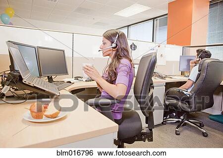 Stock Photograph - Business people working in cubicle. Fotosearch