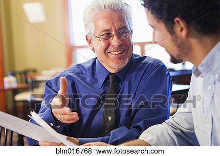 Businessmen talking in cafe View Large Photo Image Stock Photo - Businessmen talking in cafe. Fotosearch