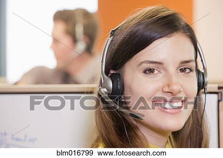 Caucasian businesswoman wearing headset View Large Photo Image Stock Photo - Caucasian businesswoman wearing headset. Fotosearch
