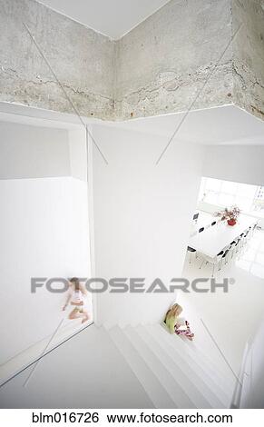 Stock Photograph - Caucasian girls playing in house. Fotosearch