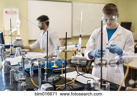 Caucasian students working in chemistry lab View Large Photo Image Stock Image - Caucasian students working in chemistry lab. Fotosearch