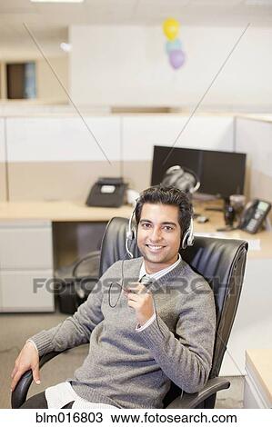 Indian businessman wearing headset View Large Photo Image Stock Image - Indian businessman wearing headset. Fotosearch