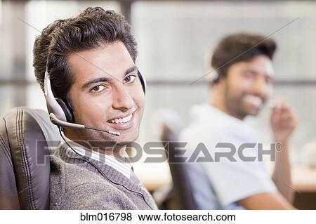 Indian businessman wearing headset View Large Photo Image Stock Photo - Indian businessman wearing headset. Fotosearch