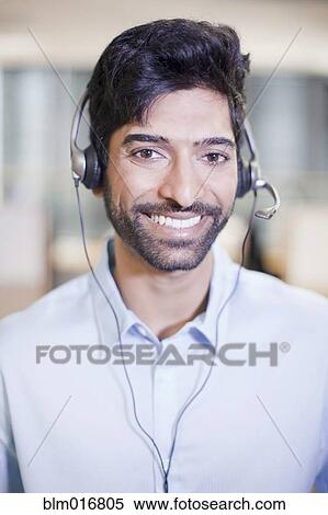Indian businessman wearing headset View Large Photo Image Stock Photography - Indian businessman wearing headset. Fotosearch