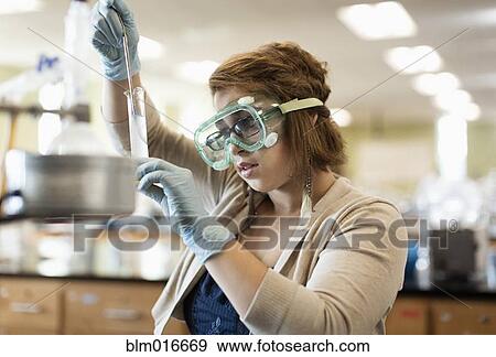 Mixed race student working in chemistry lab View Large Photo Image Stock Photo - Mixed race student working in chemistry lab. Fotosearch