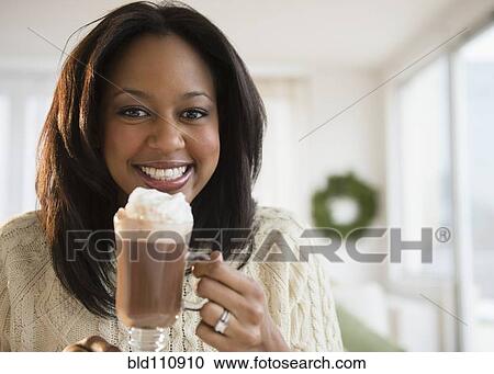 African American woman drinking hot chocolate View Large Photo Image Stock Image - African American woman drinking hot chocolate. Fotosearch