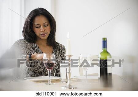 Stock Image - African American woman waiting for date. Fotosearch