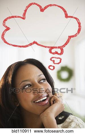 Stock Image - African American woman with thought bubble. Fotosearch