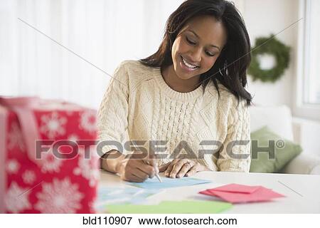 African American woman writing at desk View Large Photo Image Stock Photo - African American woman writing at desk. Fotosearch