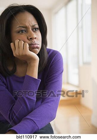Anxious African American woman frowning View Large Photo Image Stock Photo - Anxious African American woman frowning. Fotosearch