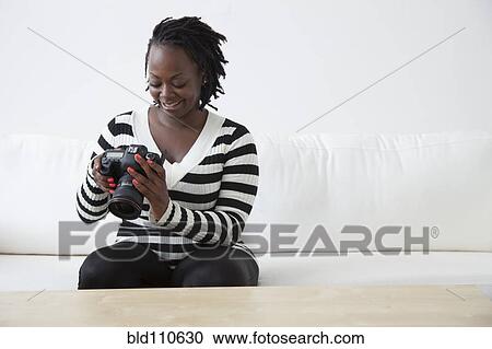 Stock Image - Black woman looking at camera. Fotosearch