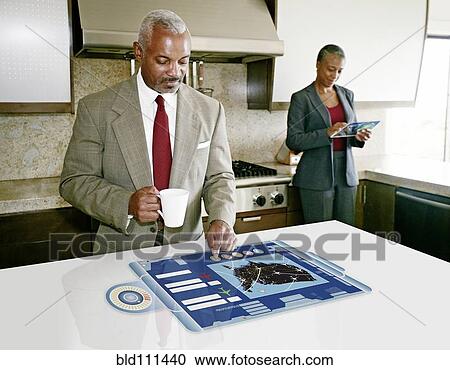 Stock Image - Businessman using computer in table. Fotosearch