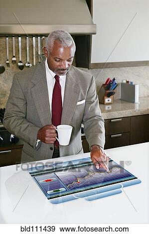 Businessman using computer in table View Large Photo Image Stock Photo - Businessman using computer in table. Fotosearch