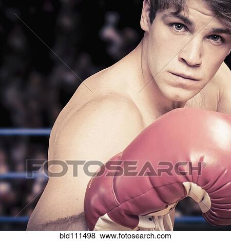 Stock Photo - Caucasian boxer with fists raised. Fotosearch