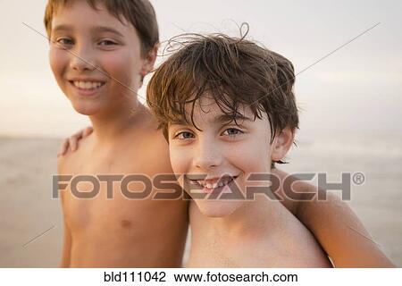 Caucasian boys walking on beach View Large Photo Image Stock Image - Caucasian boys walking on beach. Fotosearch