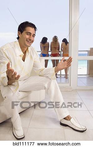 Caucasian man sitting in armchair View Large Photo Image Stock Photo - Caucasian man sitting in armchair. Fotosearch