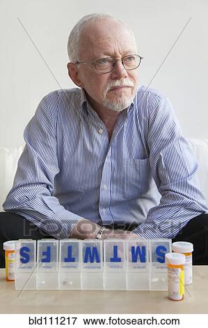 Caucasian man taking pills View Large Photo Image Stock Photo - Caucasian man taking pills. Fotosearch