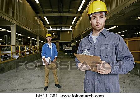Caucasian workers with clipboards in warehouse View Large Photo Image Stock Image - Caucasian workers with clipboards in warehouse. Fotosearch