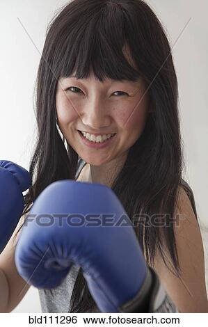 Stock Photograph - Chinese boxer with raised fists. Fotosearch
