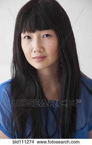 Picture - Chinese woman with serious face. Fotosearch