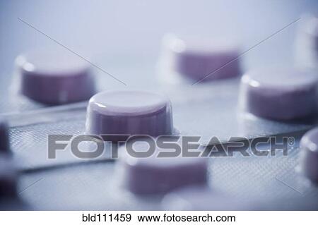 Stock Photo - Close up of pills in blister pack. Fotosearch