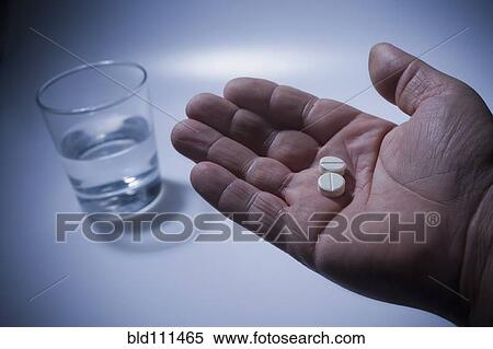 Close up of pills in Hispanic man's hand View Large Photo Image Stock Photography - Close up of pills in Hispanic man's hand. Fotosearch
