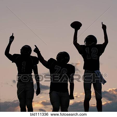 Stock Photograph - Football players cheering in game. Fotosearch