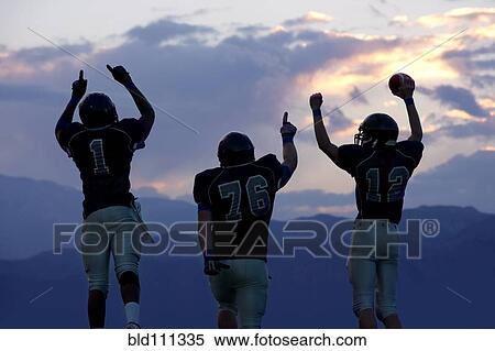 Football players cheering in game View Large Photo Image Stock Photography - Football players cheering in game. Fotosearch