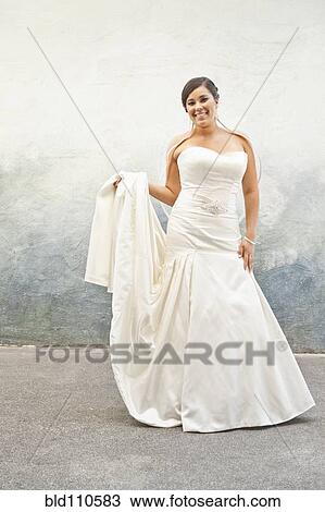 Stock Image - Hispanic bride in wedding dress. Fotosearch